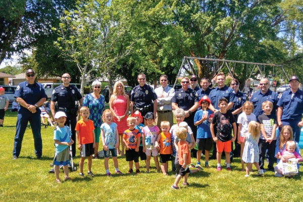 Is Klamath Falls Safe - Local police pose for a photo with leaders and community members at Mills-Kiwanis Park